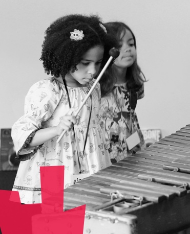 Girls playing xylophone